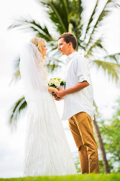 istock Just married couple holding hands 461795461