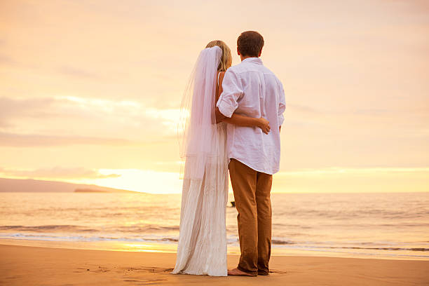 istock Just married couple on tropical beach at sunset 461795505