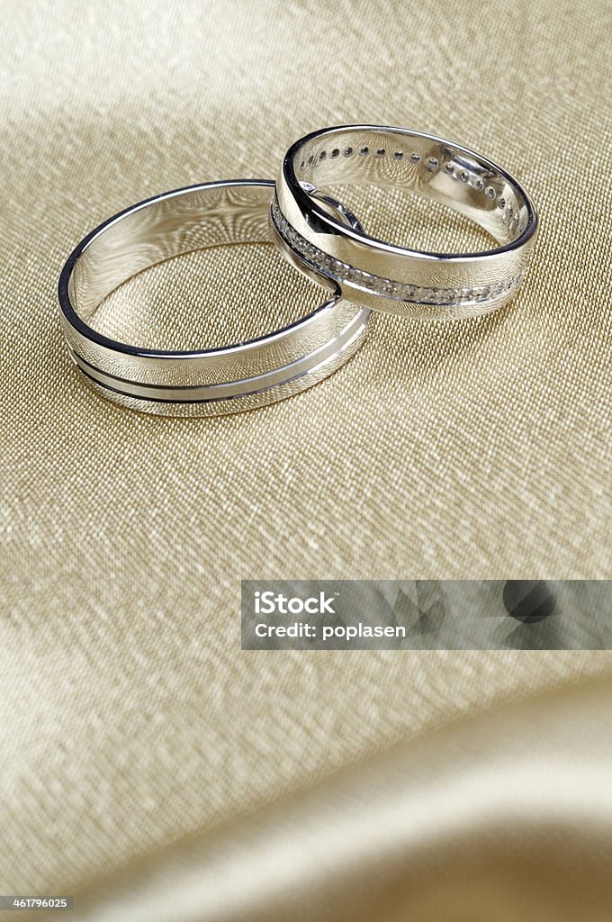 elegant engagement rings white gold rings on each other in satin Celebration Stock Photo