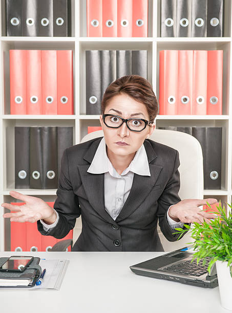istock Business woman shrugs 461796255