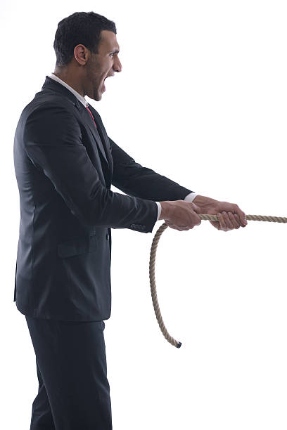 istock business man with rope isolated on white background 461797517