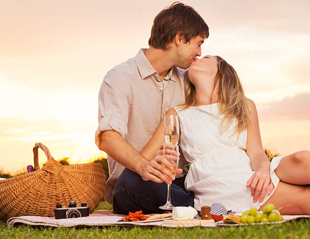 istock Attractive couple kissing on romantic picnic 461801353
