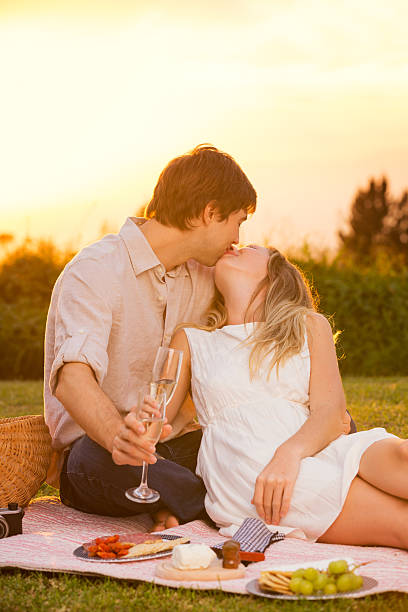 istock Attractive couple kissing on romantic picnic 461801381