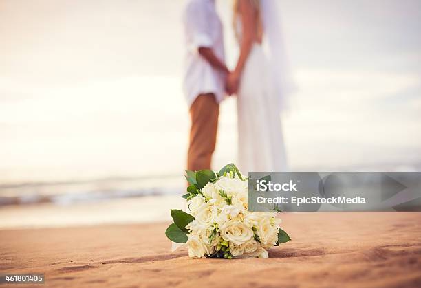 Just Married Couple Holding Hands On The Beach Stock Photo - Download Image Now - Wedding, Beach, Honeymoon
