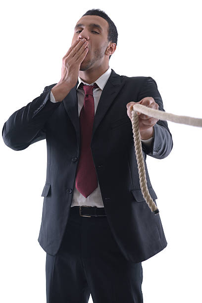 istock business man with rope isolated on white background 461802631