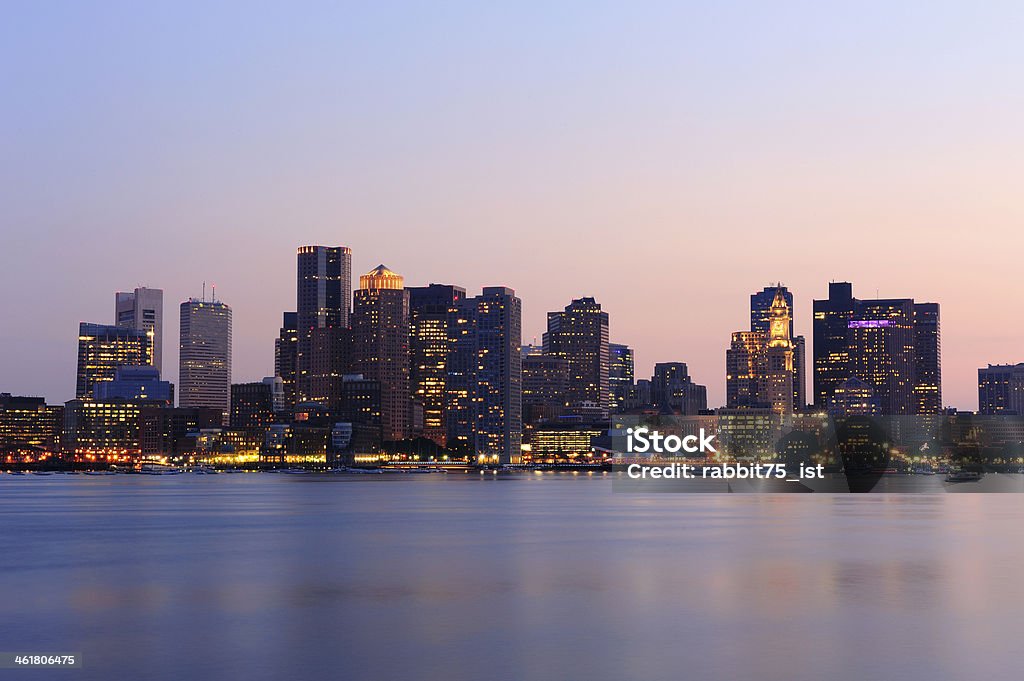 Boston cityscape at dusk Boston downtown at dusk with urban buildings illuminated at dusk after sunset. Architecture Stock Photo