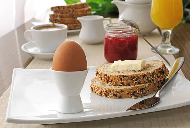 istock Breakfast with soft-boiled egg and slices of oatmeal bread 461807737