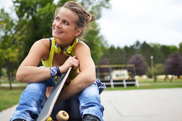 istock beautiful woman with the skateboard 461809375