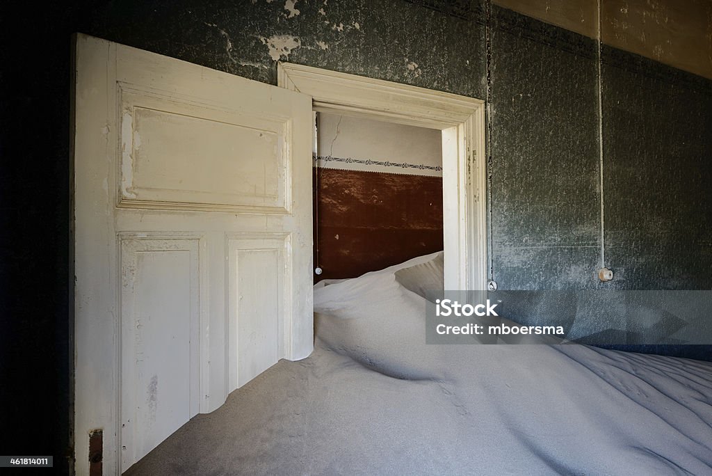 kolmanskop sand house House with electric light switch and filled with desert sand Africa Stock Photo