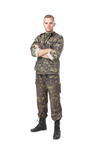 Full length portrait of serious army soldier with his arms crossed isolated on white background