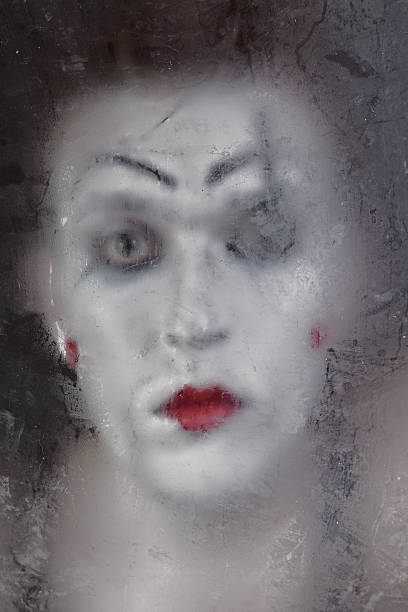 istock Scary face screaming mime for murky glass 461818837