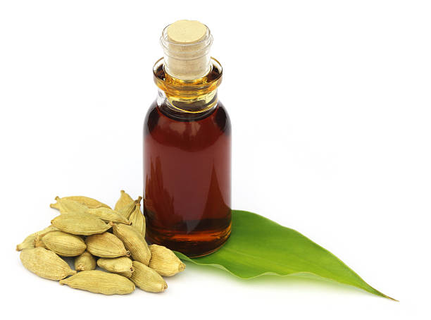 istock Cardamons with essential oil 461824139