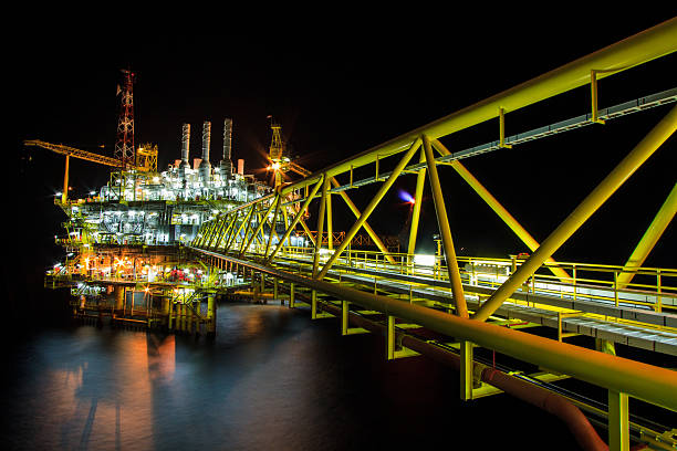 Offshore construction platform in night. stock photo