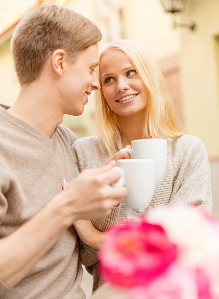 istock happy couple drinking coffee in city cafe 461829677