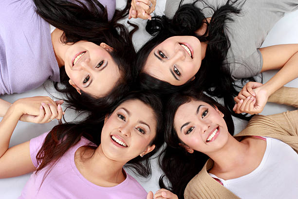 istock asian women relaxing smiling lying on the floor 461851223