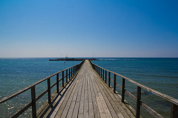 Very long wooden pier stock photo