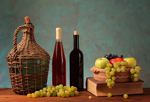 istock Fresh fruit and wine in glass bottles 461856087