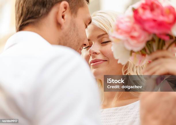 Couple Holding Flowers On Wedding Day Stock Photo - Download Image Now - City, Couple - Relationship, Summer