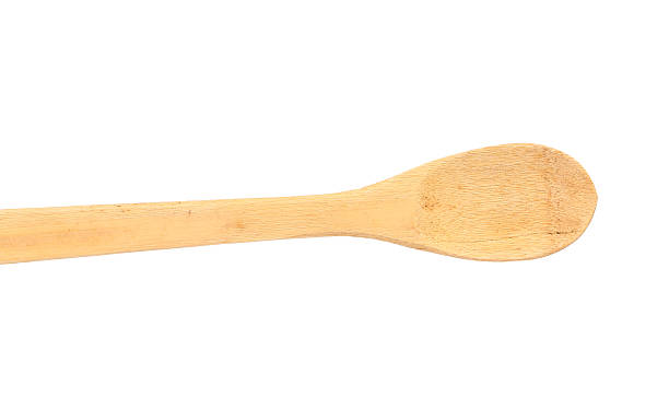 木製スプーンでさっと混ぜます。 - cooking kitchen utensil wood isolated ストックフォトと画像