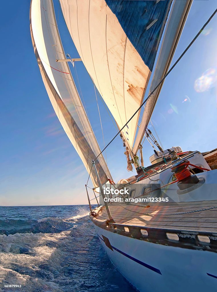 Close up view of a sailing yacht boat on the ocean Sailing boat in blue open sea Sailboat Stock Photo