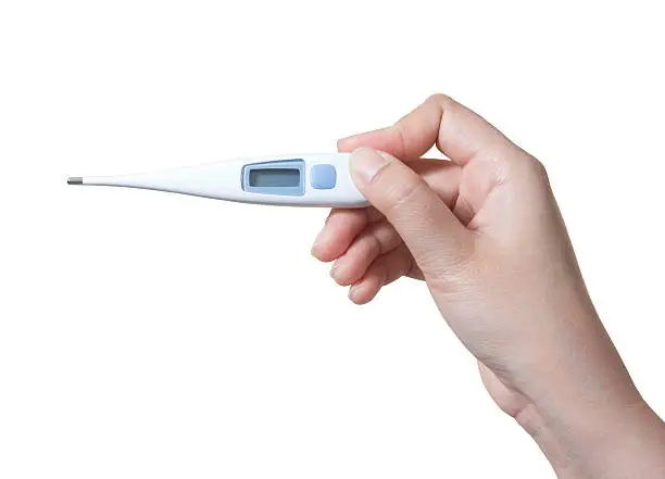 Photo of Medical thermometer in hand isolated on white background