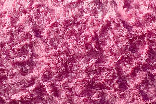 Pink fluffy carpet, textile background stock photo