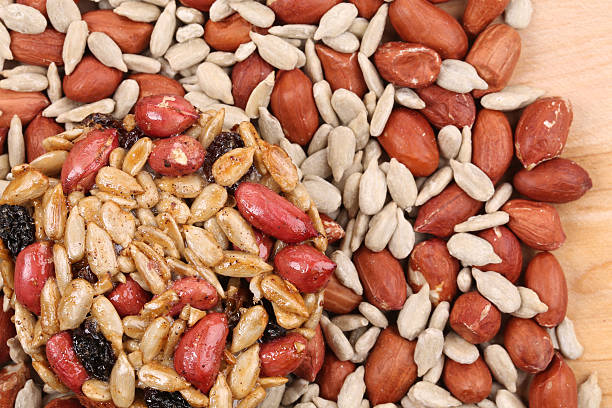Round candied seeds and nuts with peanuts. Whole background.