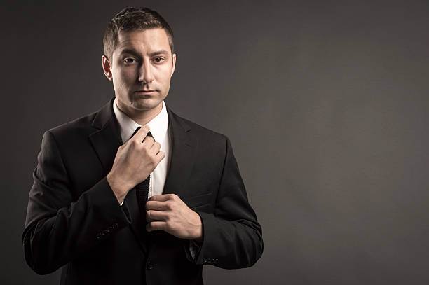 istock Businessman Straightening Tie 461892103