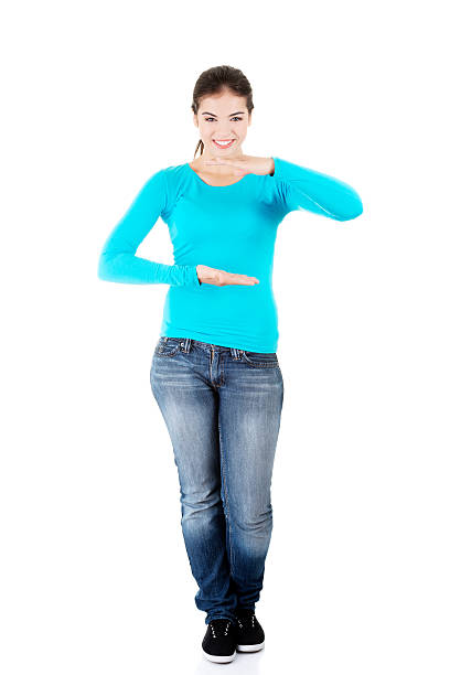 istock Happy , excited young woman presenting copy space on her palm 461892359
