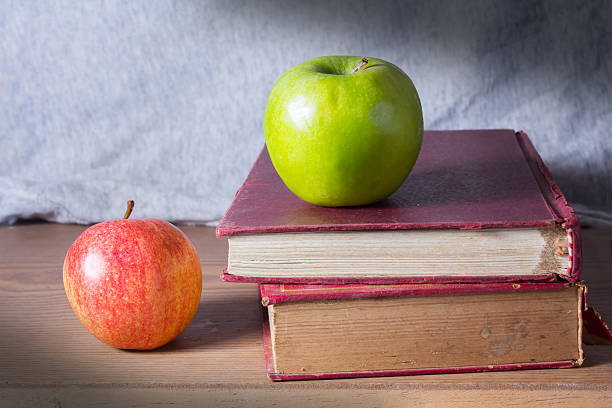 istock Antique books with apples 461893439