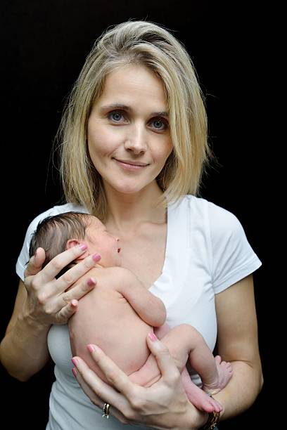 istock Mom with her newborn 461894135