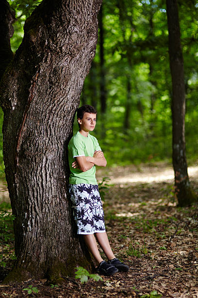 istock Teenager in the forest 461894487