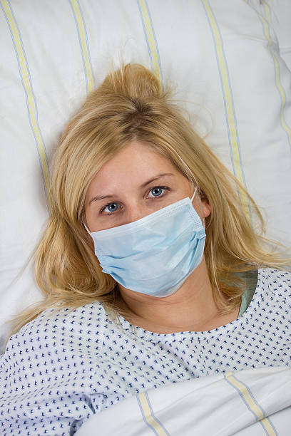 istock female patient in hospital quarantine 461895103