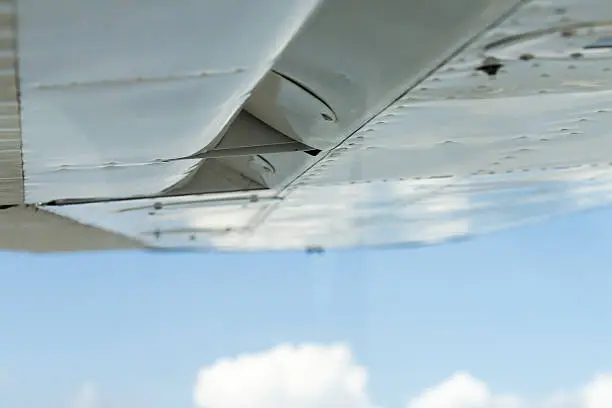 airplane wing with background sky