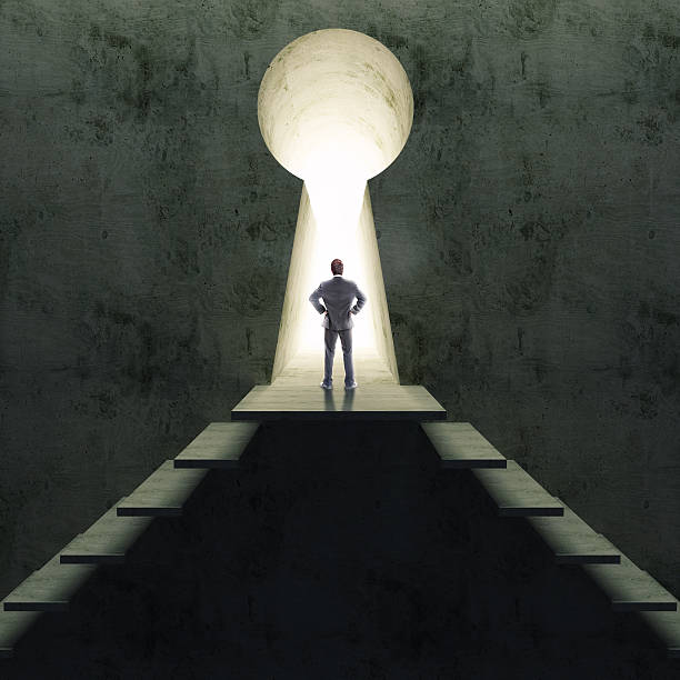 istock Silhouette of businessman standing in keyhole. 461906117