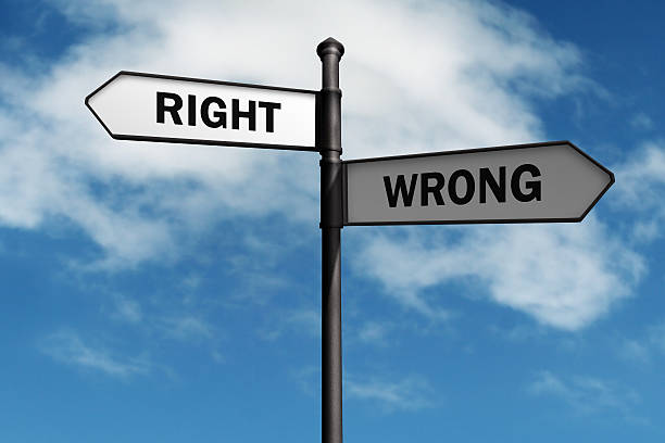 istock Right and wrong arrow street signs against a cloudy sky 461908949