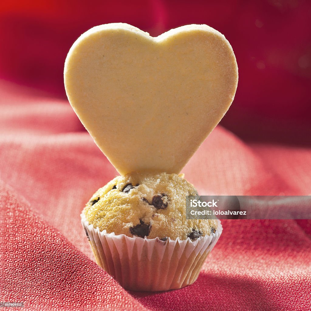 Muffin and heart shape cookie Muffin and heart shaped cookie Baked Stock Photo