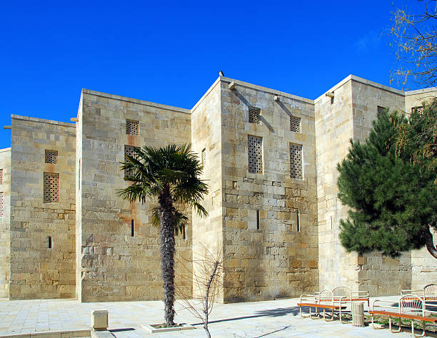Baku, Azerbaijan: Shirvan Shah's palace - exterior walls with stone carved windows - Baku walled city - UNESCO world heritage site - photo by M.Torres