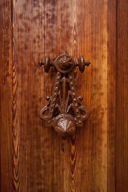 Ancient rarity doorhandle on a wooden door