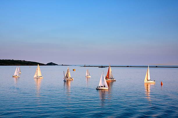 Regatta at sunset race of boats in the bay of Plymouth Devon stock pictures, royalty-free photos & images