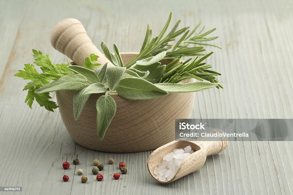 herbs and spices mortar and pestle with herbs and spices Cilantro Stock Photo