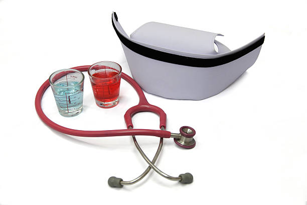 alcohol in cup and stethoscope or nurse hat