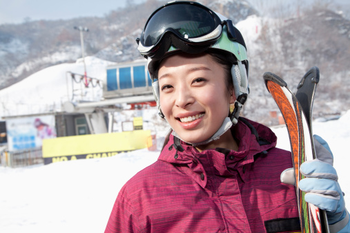 Skiing sport. Front view. In action. Sportsman in a red ski suit. Isolated. Sport