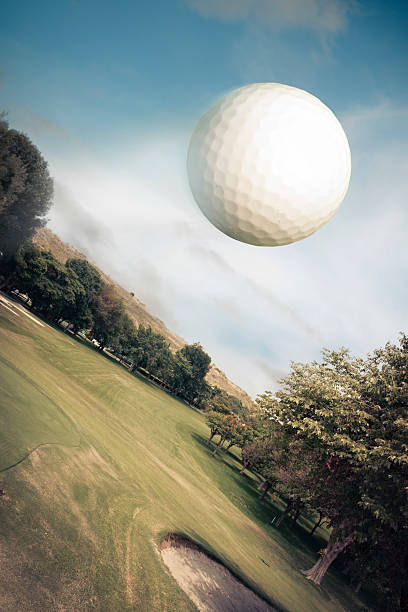 istock Golf ball flying over green field 461931595