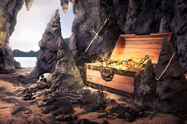 istock open treasure chest with shinny gold in a cave 461931611
