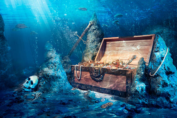 Open treasure chest underwater wooden treasure chest submerged underwater with light rays trunk furniture photos stock pictures, royalty-free photos & images