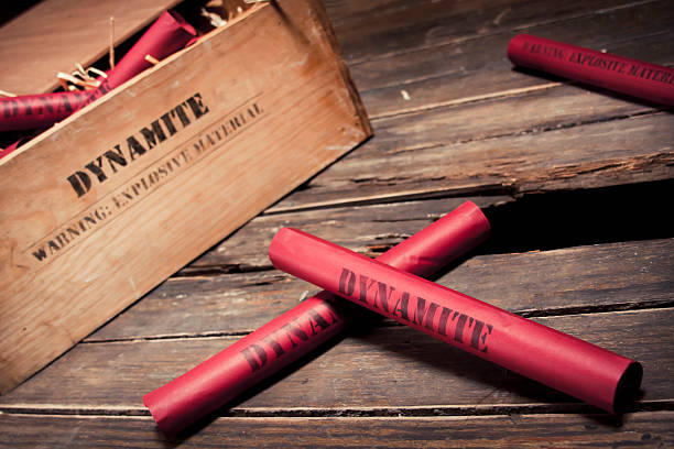 high contrast photo of dynamite sticks on a box