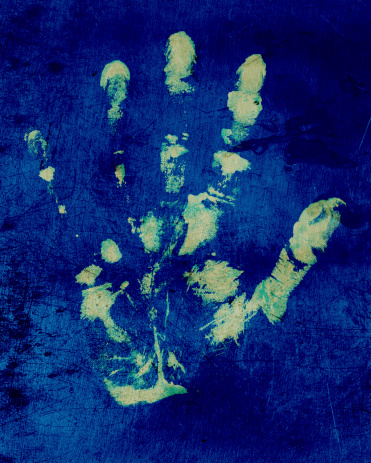 hand print on a old blue wall