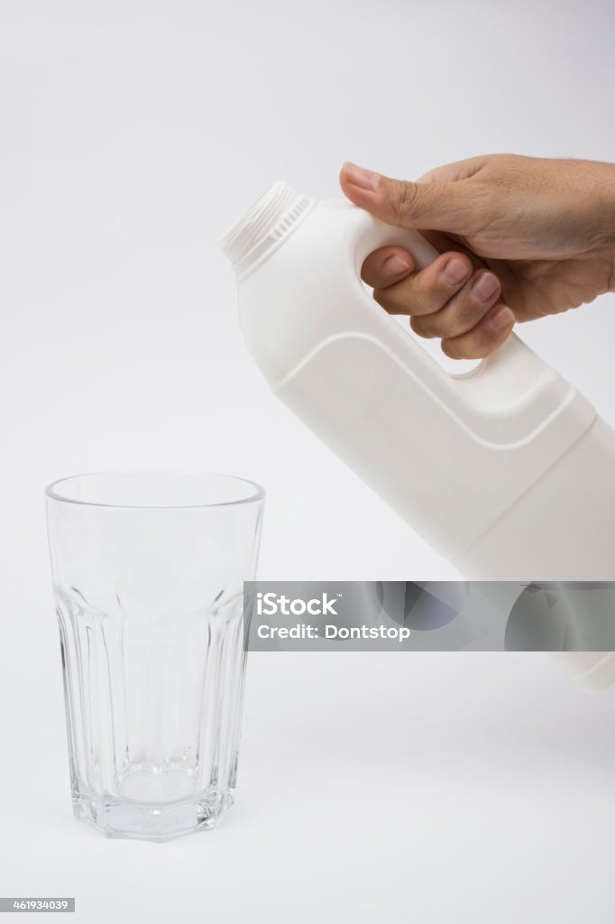 Hand in Milk bottle and glass Hand in Milk bottle and glass ,isolated on white Color Image Stock Photo