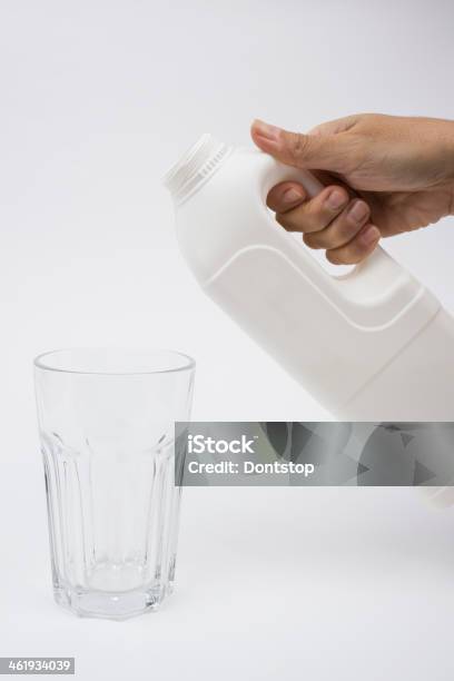 Hand In Milk Bottle And Glass Stock Photo - Download Image Now - Color Image, Human Body Part, Human Hand